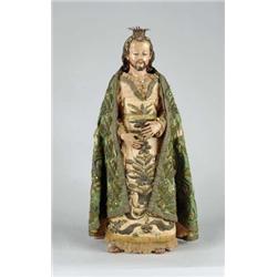 FINE CARVED WOOD AND POLYCHROME CLOTHED SANTOS.