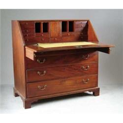 MAHOGANY FOUR DRAWER CHIPPENDALE SLANT FRONT DESK.