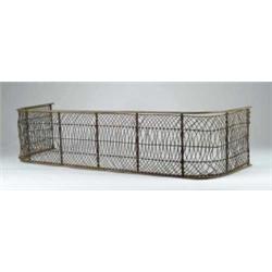 19TH CENTURY IRON AND BRASS FIREPLACE FENDER.