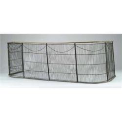 19TH CENTURY IRON AND BRASS FIREPLACE FENDER.