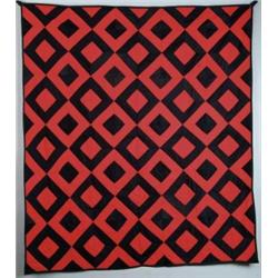 RED AND BLACK PATCHWORK QUILT.