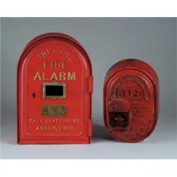 TWO RED CAST IRON FIRE ALARM BOXES.