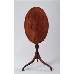 HEPPLEWHITE MAHOGANY OVAL TILT TOP CANDLESTAND.