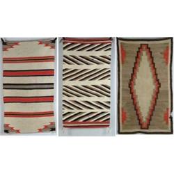 THREE NAVAJO RUGS.