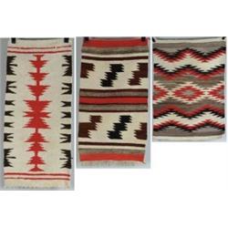 THREE NAVAJO RUGS.
