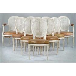 SET OF TWELVE LOUIS XVI STYLE IVORY PAINTED CANE SEAT DINING CHAIRS.