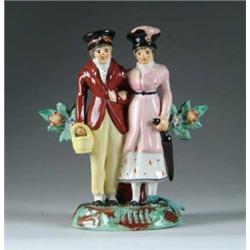 STAFFORDSHIRE FIGURAL GROUP OF MAN AND WOMAN.