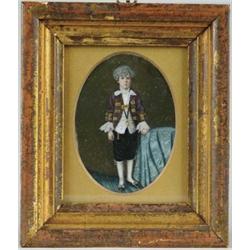 MINIATURE PAINTING ON IVORY OF A YOUNG BOY IN FANCY ATTIRE.