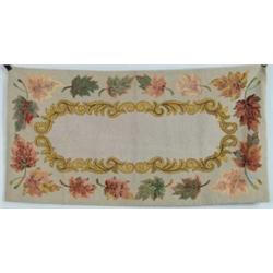 FINE HOOKED RUG WITH LEAVES AND SCROLL DESIGN.