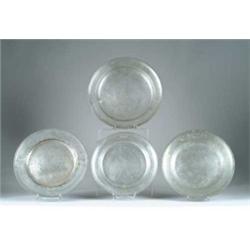 FOUR PEWTER CHARGERS.