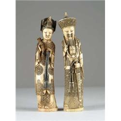 PAIR OF FAUX IVORY FIGURINES.