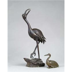 TWO BRONZE BIRDS.