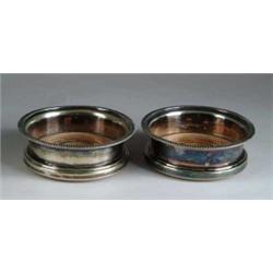 PAIR OF SHEFFIELD SILVER PLATED WINE COASTERS.