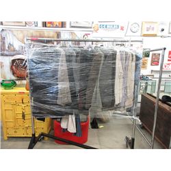 Rack of Assorted Shirts and Jackets