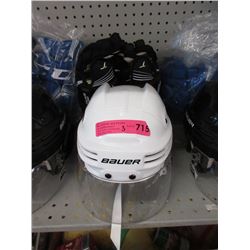 New White Bauer Helmet with Black CCM Gloves