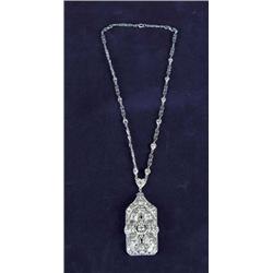 OUTSTANDING ART DECO PENDANT AND CARTIER MARKED NECKLACE IN PLATINUM, DIAMOND AND SAPPHIRES.