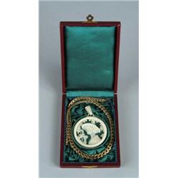 CARVED IVORY PENDANT OF YOUNG WOMAN ALONG WITH 14K YELLOW GOLD NECKLACE.