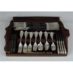 100-PIECE STERLING FLATWARE SET BY WALLACE IN THE GRAND BAROQUE PATTERN.