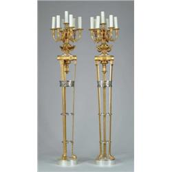 OUTSTANDING PAIR OF BRONZE AND SILVER TORCHERES.