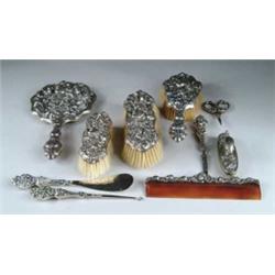 OUTSTANDING AND RARE 10-PIECE STERLING DRESSER SET WITH WOMEN’S HEADS.