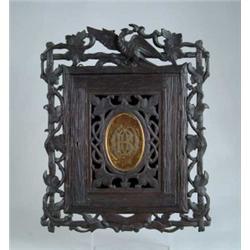 CARVED BLACK FOREST WALL CABINET.