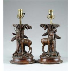 PAIR OF CARVED BLACK FOREST TYPE TABLE LAMPS.