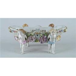 PORCELAIN HAND PAINTED CENTER BOWL WITH FOUR CHERUBS.