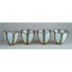 A FINE SET OF FOUR LEADED GLASS SHADES.