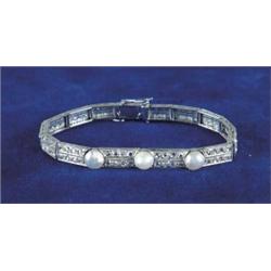 ART DECO DIAMOND AND BAROQUE PEARL BRACELET.