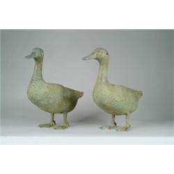 PAIR OF VERDIGRIS BRONZE GEESE FORMED GARDEN FOUNTAIN ORNAMENTS.