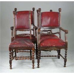 SET OF FOUR DINING CHAIRS WITH CARVED HEADS.
