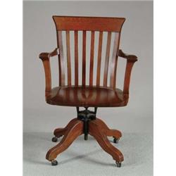 OAK REVOLVING DESK ARMCHAIR.