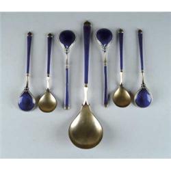 SEVEN PIECE ENAMELED AND STERLING BERRY SPOON SET.