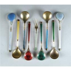 LOT OF EIGHT ENAMELED STERLING SPOONS.