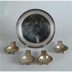 FOUR FOOTED STERLING SPOON RESTS & TIFFANY & CO. SILVER PLATED ROUND TRAY.