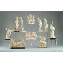 GROUP OF ELEVEN PLASTIC/IVORINE STATUES.