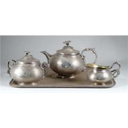FOUR PIECE SILVER-PLATED TEA SERVICE BY CHRISTOFLE.