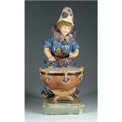 FINE POTTERY FIGURINE OF CLOWN WITH LARGE DRUM.