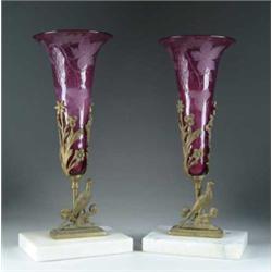 PAIR OF CUT AMETHYST GLASS EPERGNES IN FANCY FRAMES.