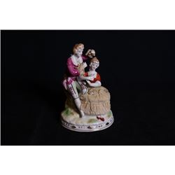 A Europe Famille-Rose porcelain figurine.