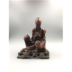 A Qing Dynasty Carved Wood“Arhat Chanting”with Base