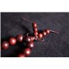 Image 3 : A rosewood Buddha string.