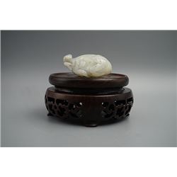 A He Tian White Jade in the Shape of a Bat and a Peach.