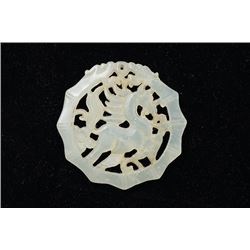 An White Jade Ornament Carved in Openwork with a Horse Shape.