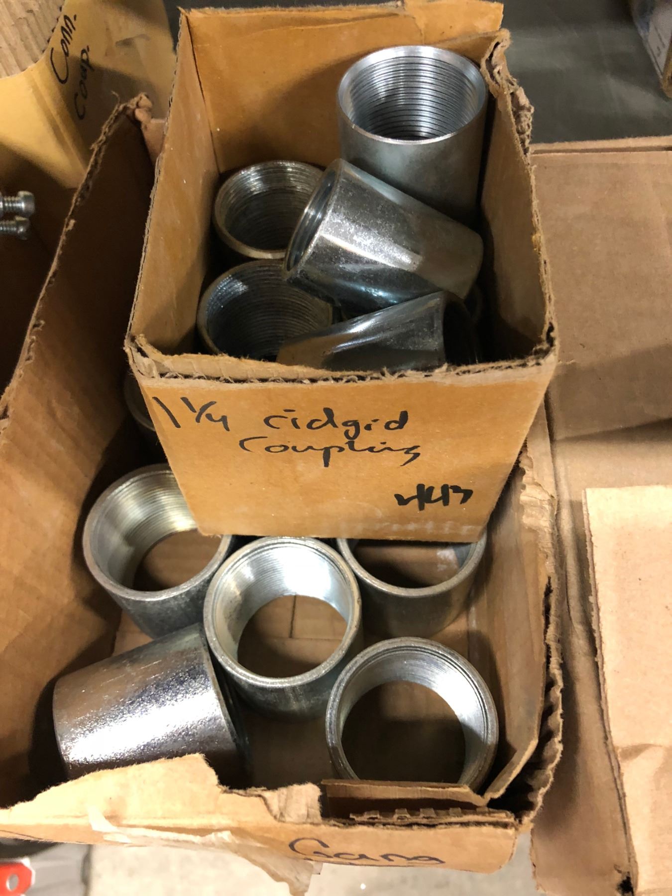 Row of 1 Box 2 1/2" Bonding Lock Nut, 2 Gang Rigid Coupling 1/4" & 2", 3 Boxes Couplings, Case of Br