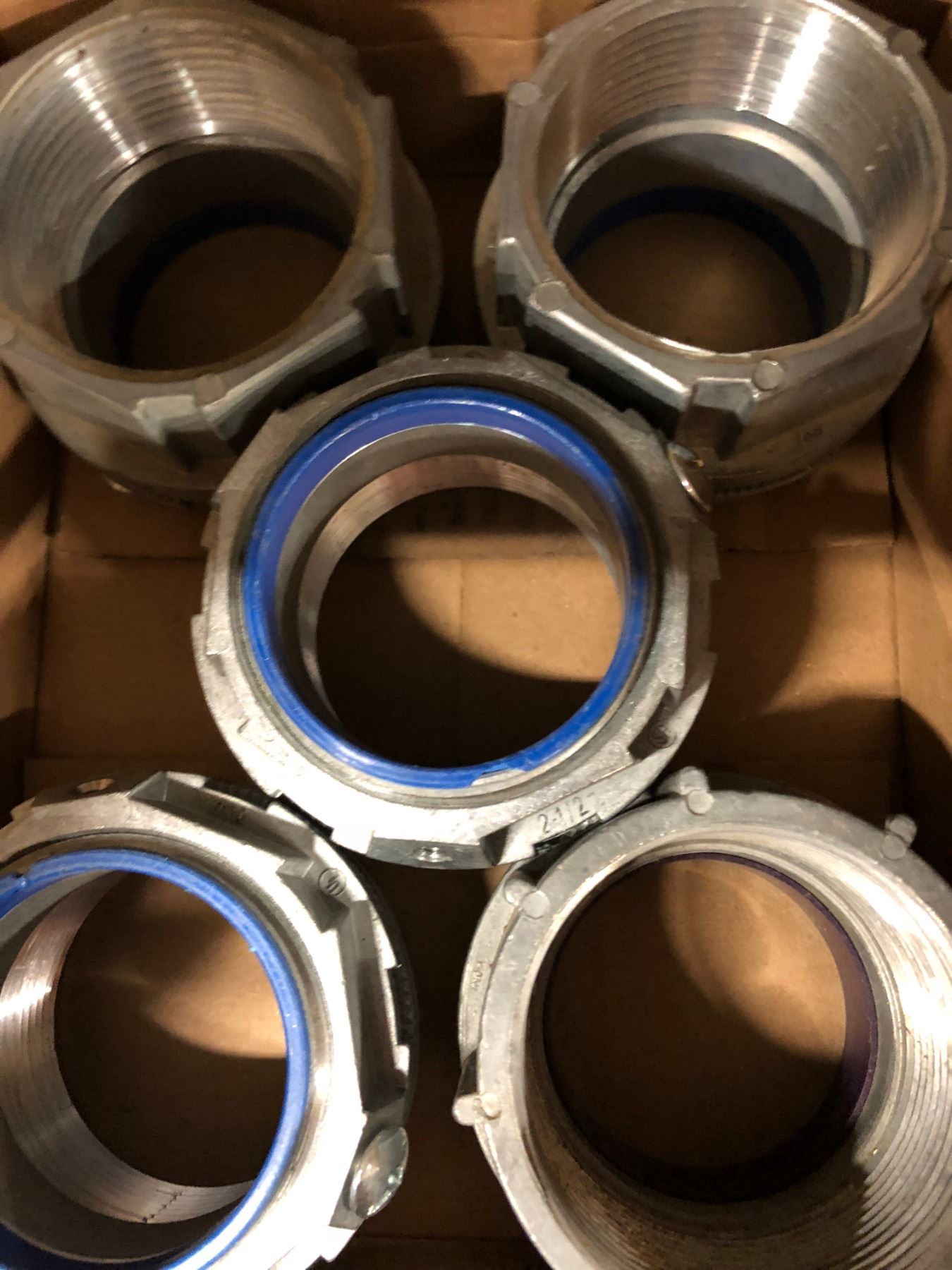 Row of 1 Box 2 1/2" Bonding Lock Nut, 2 Gang Rigid Coupling 1/4" & 2", 3 Boxes Couplings, Case of Br