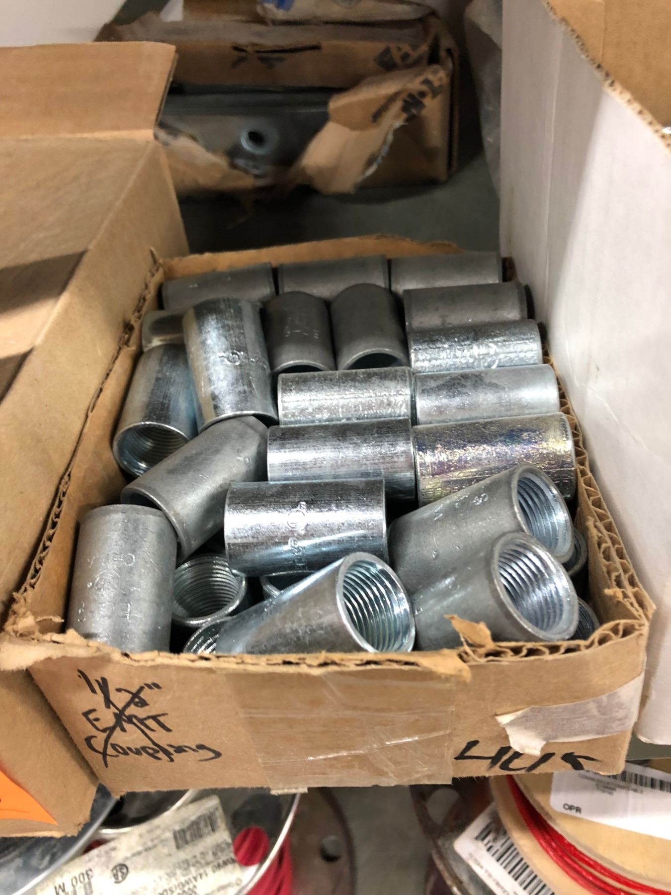 Row of 1 Box 2 1/2" Bonding Lock Nut, 2 Gang Rigid Coupling 1/4" & 2", 3 Boxes Couplings, Case of Br