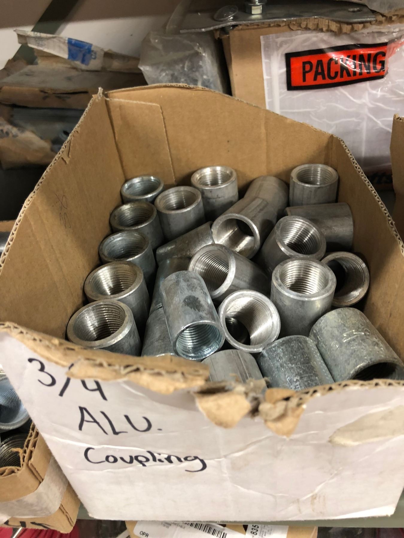 Row of 1 Box 2 1/2" Bonding Lock Nut, 2 Gang Rigid Coupling 1/4" & 2
