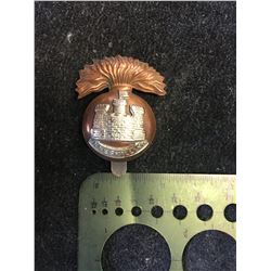 ROYAL INNISKILLING CAP BADGE.1939 FLAG TO THE RIGHT