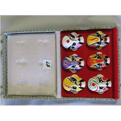 6 MINIATURE PAINTED FACE MASKS IN CASE